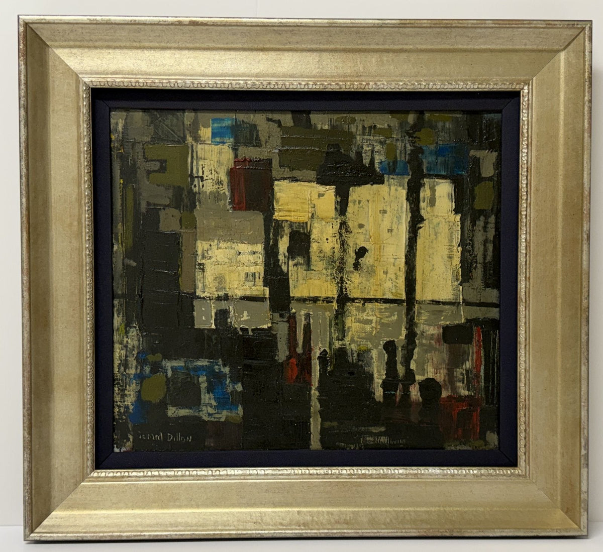 Abstract oil painting in dark greys, yellows and blues in a champagne-gold frame with a blue linen liner.